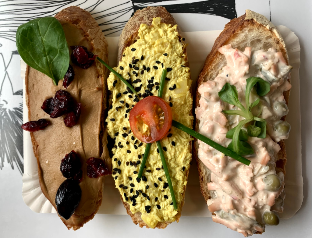 A photo of 3 different kinds of toast with toppings from Chlebíček Store, one of the best vegan restaurants in Prague. 