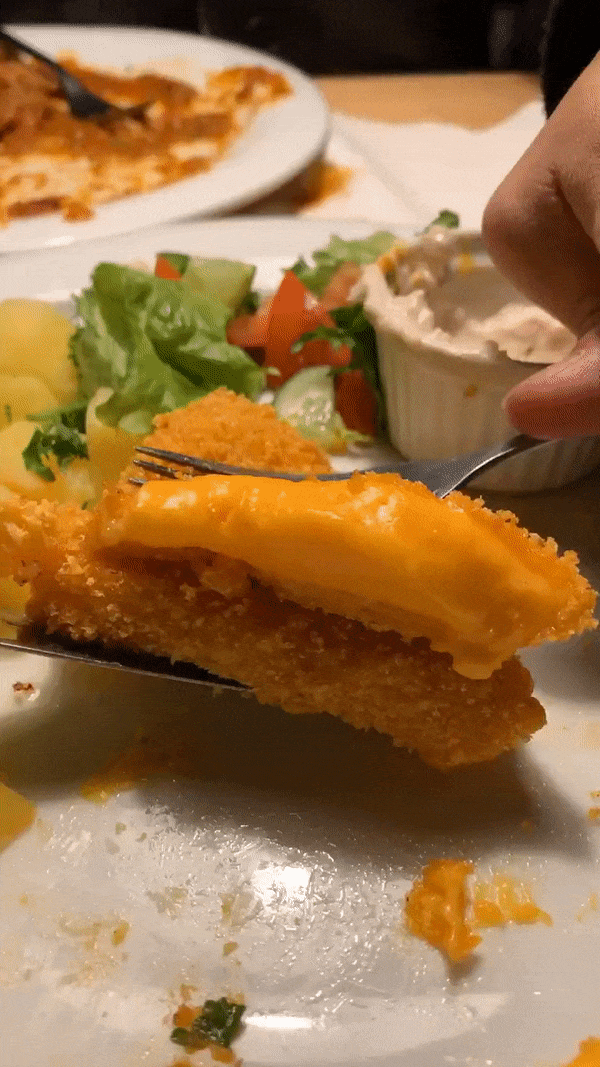 A GIF of oozing fried vegan cheese from Waipawa, one of the best vegan restaurants in Prague. 